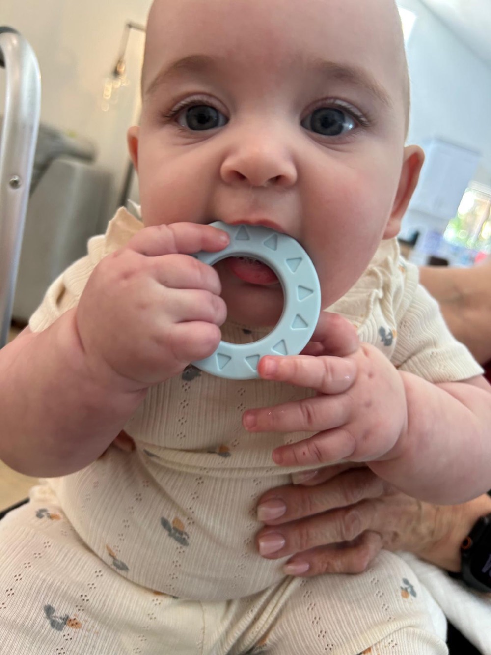 Real baby soothing sore gums on the Babylul silicone ring teether